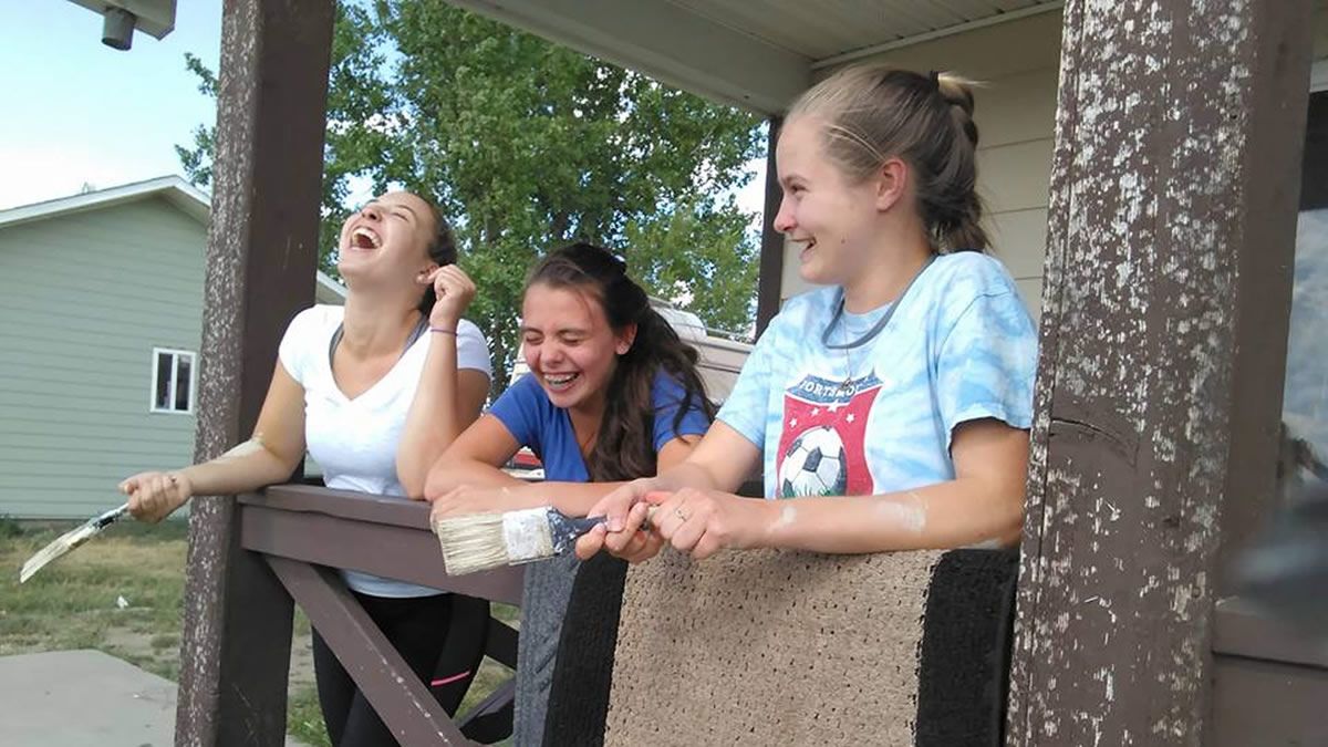 Three Girls taking a break from painting