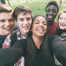 Group of happy teens taking a selfie